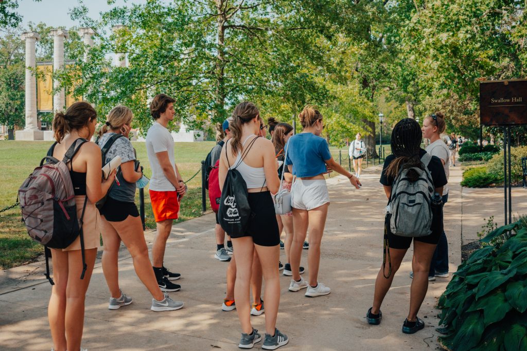 Horticulture Manager, Jenna Sommer, leads a group of students on a tour of the garden.