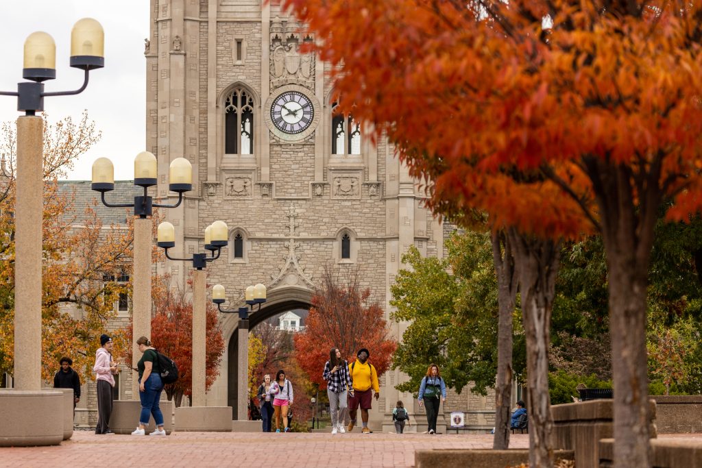 Students walking across Lowry Mall with Memorial Union in background