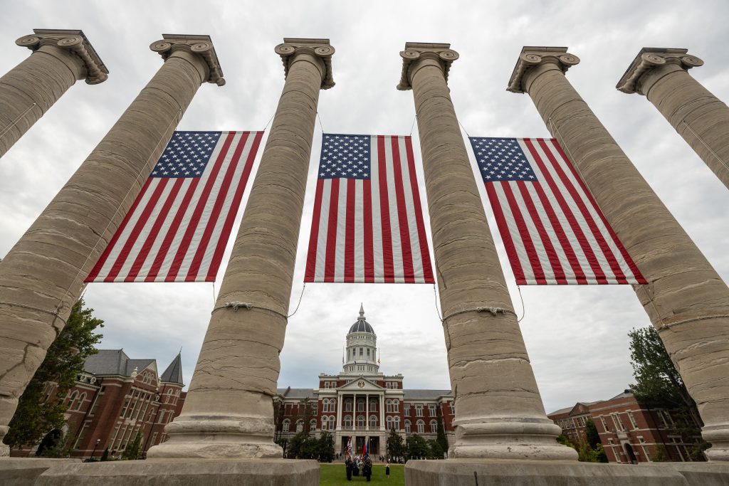 American Flags displayed on Mizzou's iconic columns.