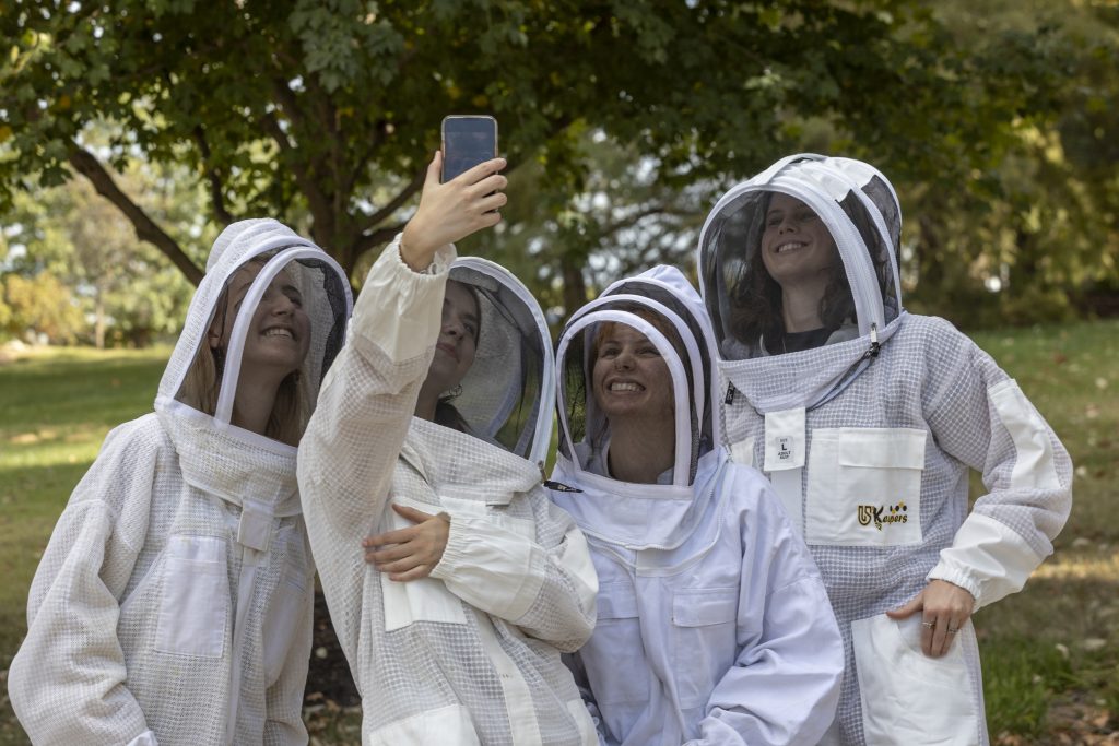 Students with Sustain Mizzou clean up beehives