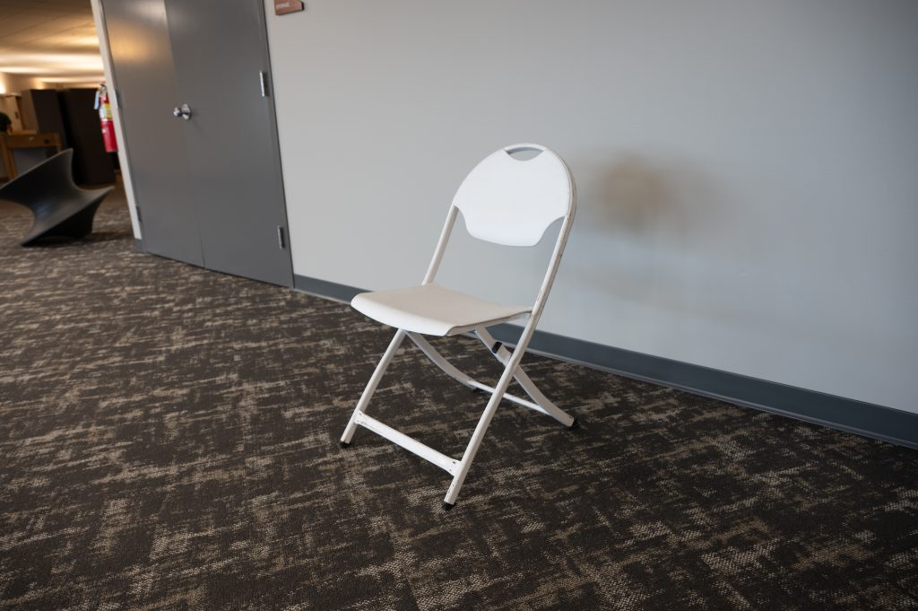White plastic folding chair
