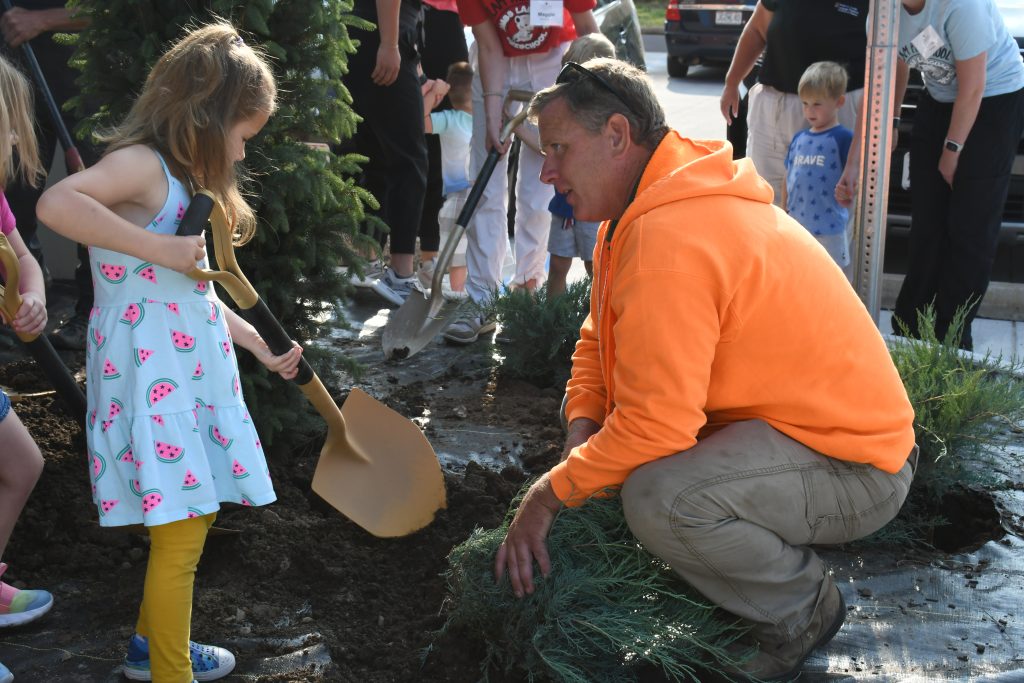 Blair Crosby helping a kid dig