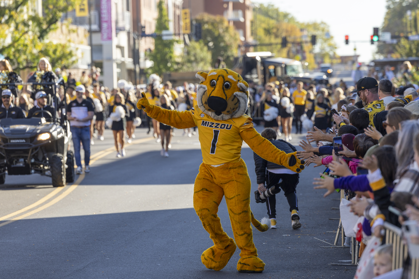 Truman walking down the street during homecoming