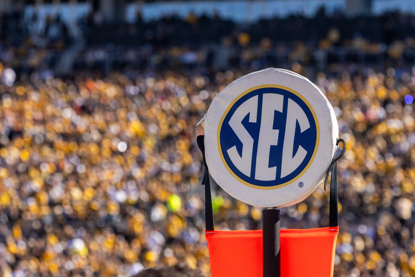 SEC sign at football game